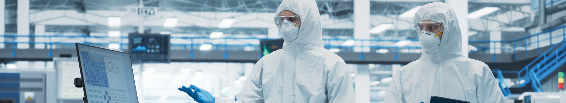 cleanroom environment with advanced monitoring systems, showcasing particle counters, pressure sensors, and environmental controls, emphasizing ISO 14644-1 compliance in precision manufacturing