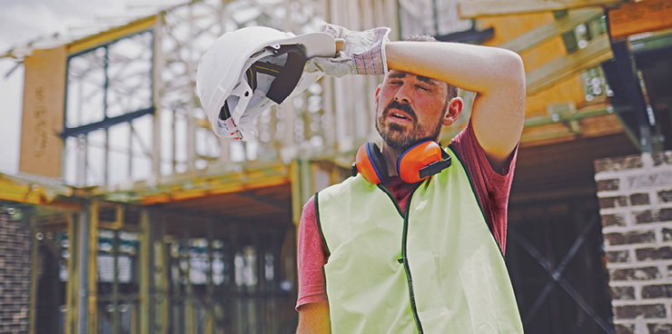 Worker suffering from heat stress