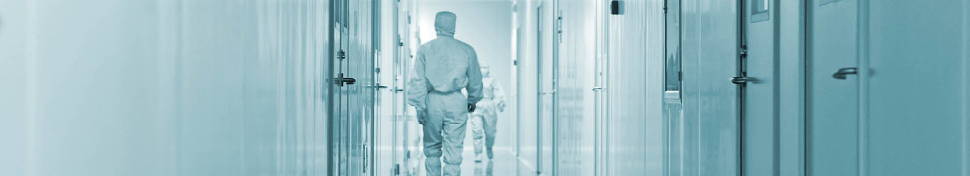 Engineers in particle-free cleanroom environment